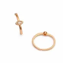 Elegant rose gold rings display.webp